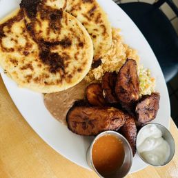 Golondrinas Mexican Grill signature dishes Veggie BurritoPlatanos MadurosTacos Papa